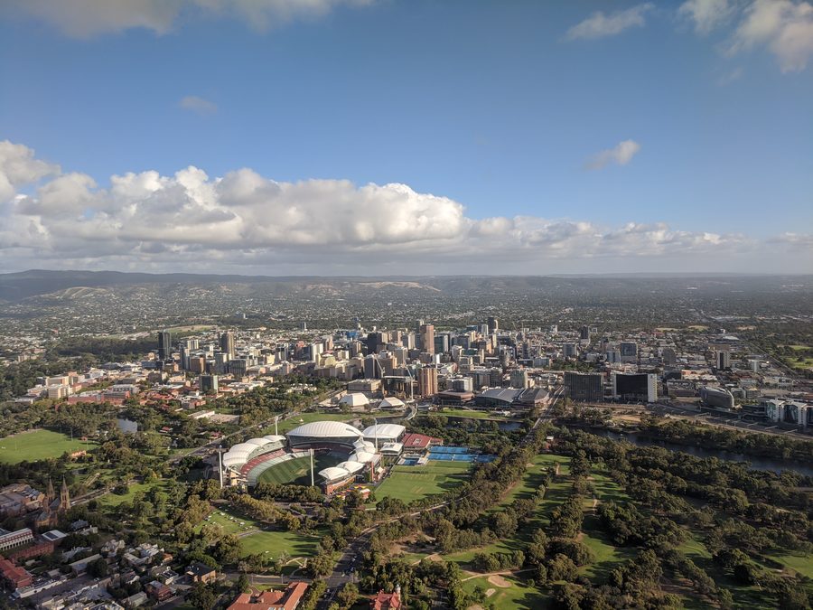 Adelaide CBD aerial showing treelined streets and Gulf St Vincent