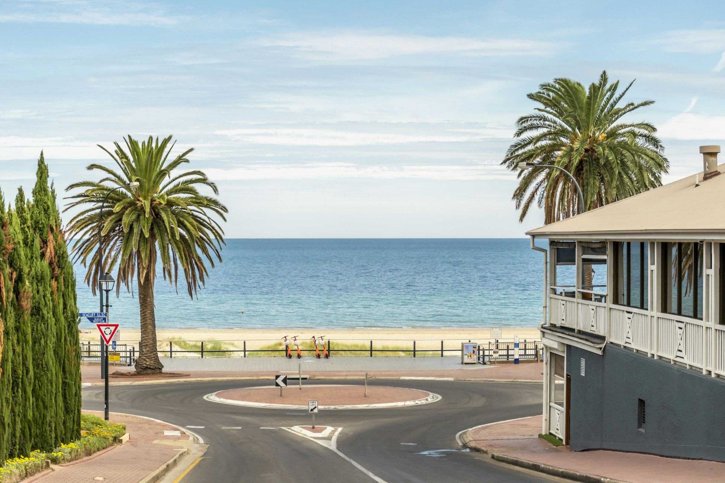 Palm-lined beachfront esplanade in Adelaide's west