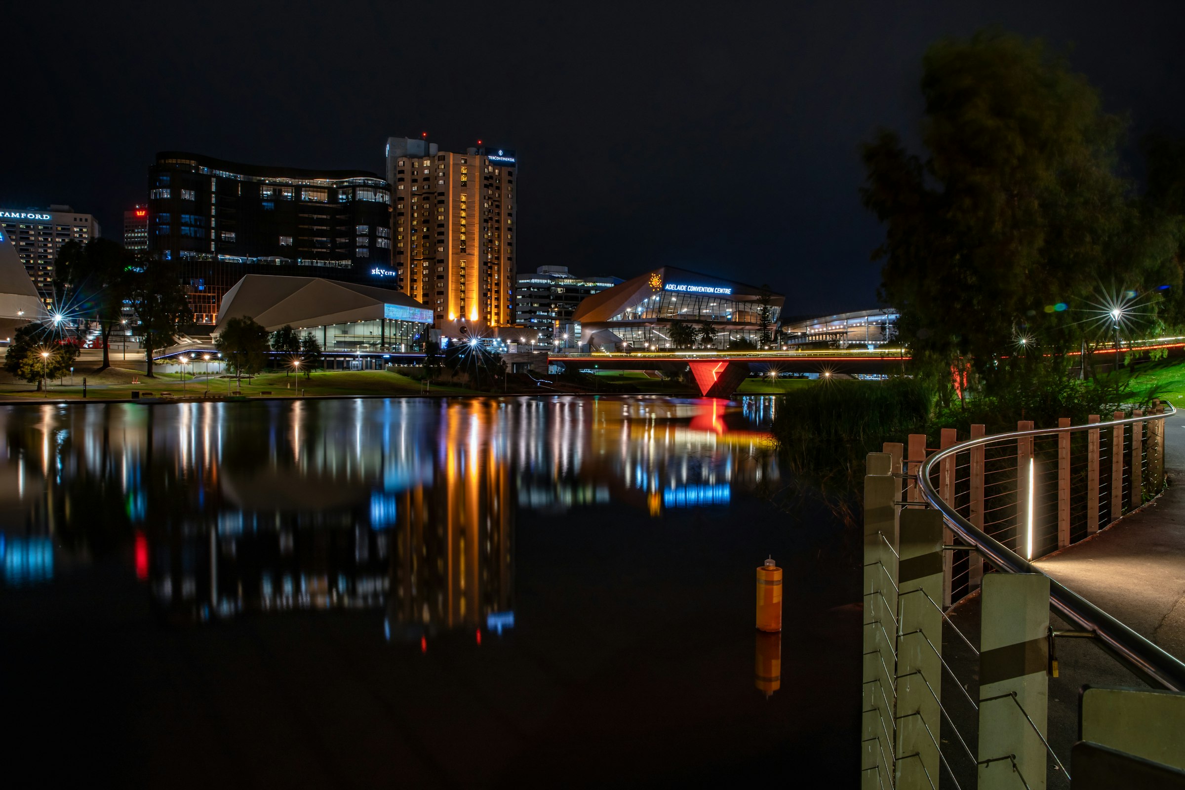 Adelaide Riverbank precinct reflected in the Torrens at night